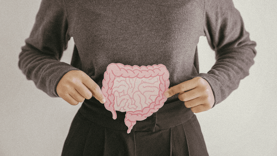 Woman holding pink intestine drawing in both her hands